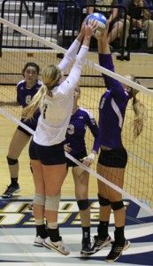 Photo by: Mark Barnes IISenior setter Kate Van Dyke (7) reaches up to block a ball against Western Carolina player during the game on Nov. 3. Many of the volleyball team members received all-conference honors today.