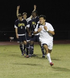 Photo by: Lindsay HartmannSophomore midfielder David Vargas Masis (11) celebrates after scoring the winning goal in the second overtime during the game against UNCG. Eagles defeated UNCG 2-1 and will play their next playoff game on Thursday against No. 1 Elon.