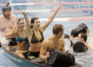 Photo by: Tasha LundSenior Andrew Campbell, sophomore Megan Mucciloo, junior Carly Flom and senior Johnathan Ball on the team Boats and Hoes won Battleship held at the indoor pool at the RAC on Tuesday.