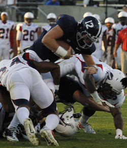 Photo by: Lindsay HartmannSenior quarterback Russell Demasi scores from two yards out during the 69-26 Eagle victory over Howard University. This was his first touchdown of the year.