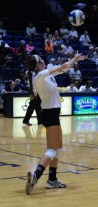 Junior outside hitter Jamie DeRatt (9) lines up a serve. DeRatt leads the team in kills, 224, and won SoCon Offensive Player of the Month for her performance throughout the September.Photo by: Christal Riley