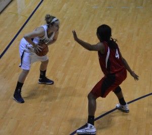 Senior guard MiMi Dubose (33) stands in triple-threat position ready to take on a defender.Photo by: Courtney Bonacci