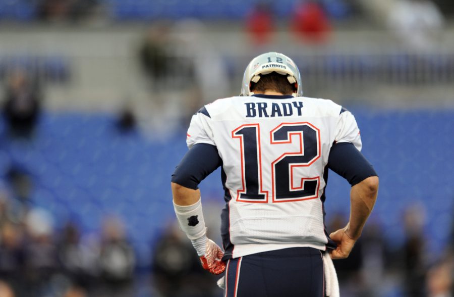 New England Patriots quarterback Tom Brady walks off the field during a 2015 game. He will serve his four-game suspension, originally scheduled for
last season, to open the 2016 season. (USA TODAY Sports)