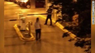 A image taken from cellphone video shows Schultz, in the white shirt, walking toward an officer. Image courtesy of cnn.com.