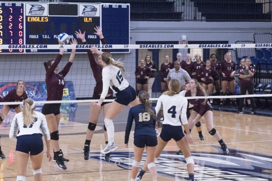 Junior April Luther sends the ball over the net. Luther has 152 digs this season. 