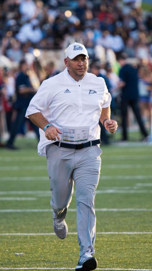 Head coach Chad Lunsford runs off the field to the locker room in the victory over South Carolina State. Lunsford is now 4-4 as head coach of the Eagles. 