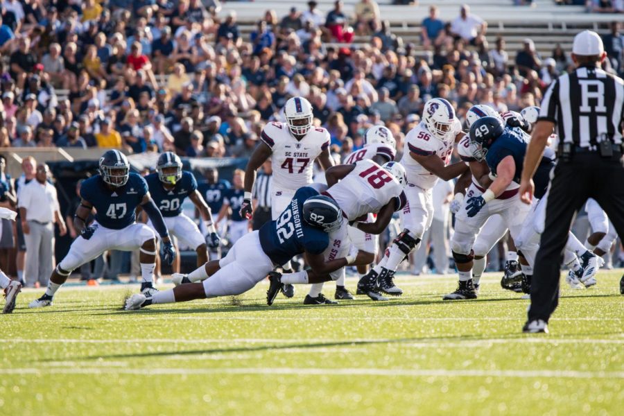 Sophomore defensive end Raymand Johnson III makes a tackle against South Carolina State. 