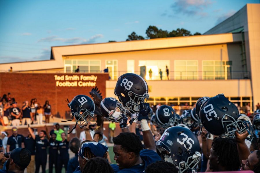 The Eagles held their helmets high for the Georgia Southern alma mater. 