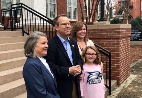 Current President Shelley Nickel (left) and Future President Kyle Marrero (center) stand on the front steps of the Marvin Pittman building with Marreros wife Jane Marrero (right) and daughter Lily Marrero (right front). 