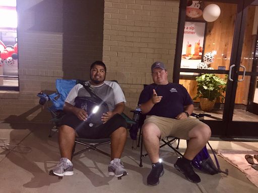 Sergio Arreguin (left) and Ryan Jackson (right) camped outside the building from as early as 4 a.m. till open at 6 a.m.