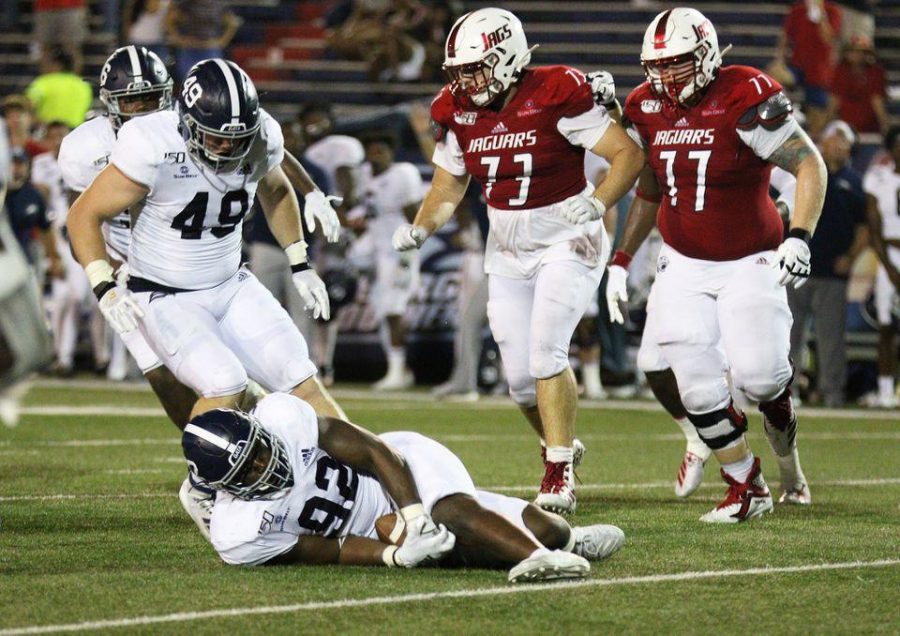 Defensive end Raymond Johnson III (92) recovered a South Alabama fumble in double overtime, allowing for the Eagles to take possession and win the game.