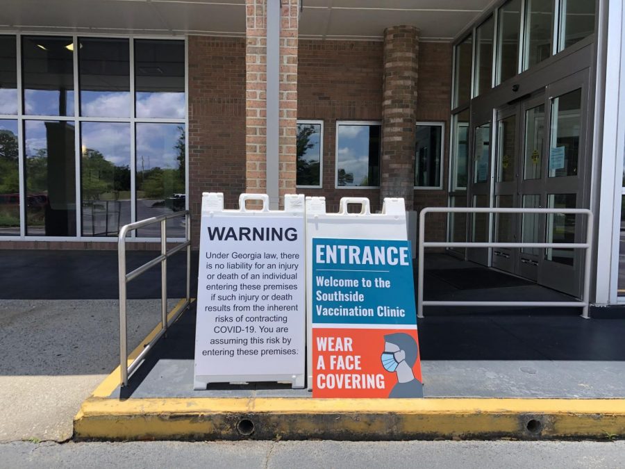 Signs outside the Armstrong Center for a COVID-19 Vaccine Clinic