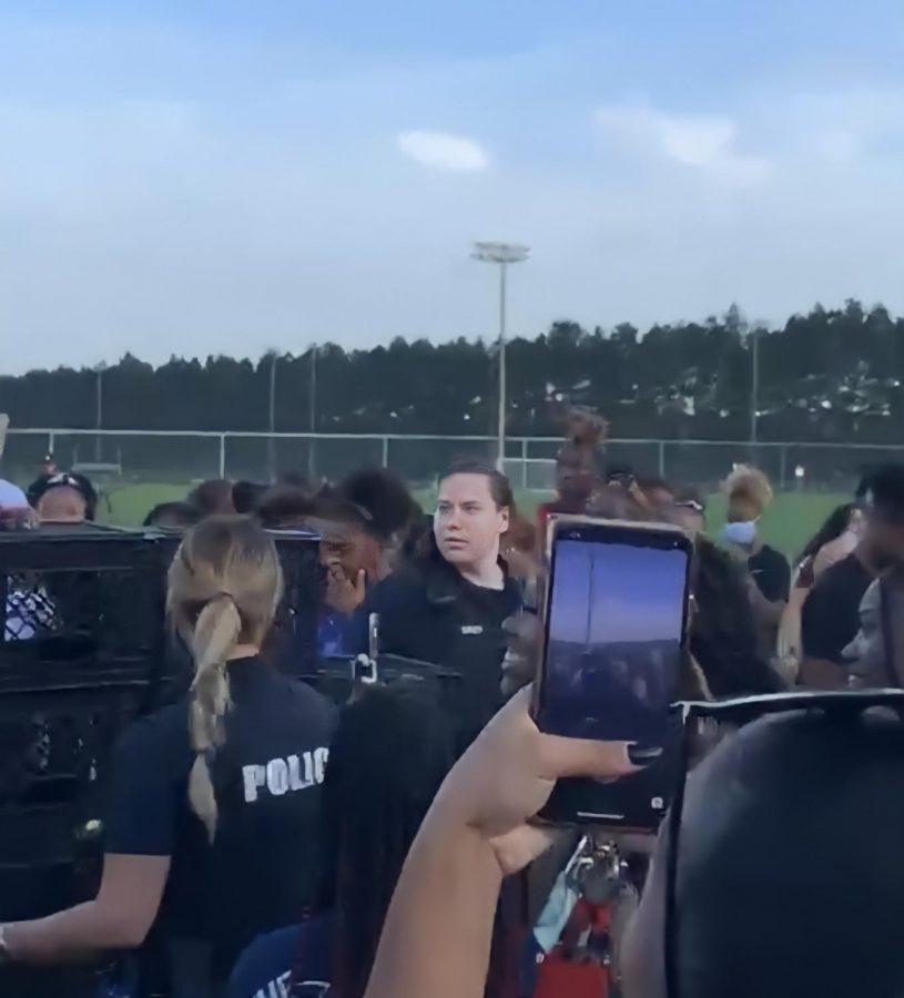 Screenshot from a video showing University Police  sending students away from the RAC field where they were trying to complete Tik Toks Milk Crate Challenge.