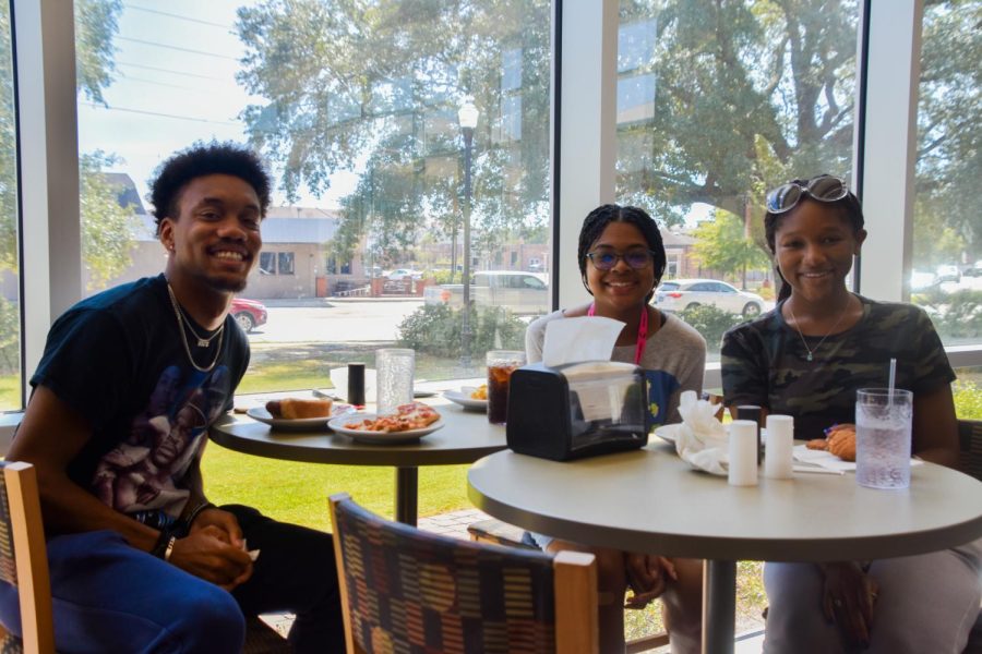 Joshua Bryant smiles with his fellow friends, Paris Henderson and Saranetra Mallette, after their mid-day lunch at the dining hall on September 14.