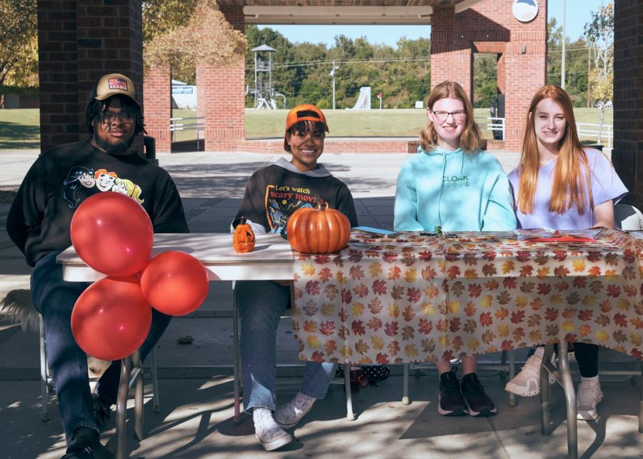 Members of Georgia Southerns Future Veterinary Society (left to right) Tyrel Ray, Ellysia Dunkins, Sam McGinn, and Devin Skelton. The group sits at the runner registration point for their Halloween Howl 5k run located next to the RAC on October 22.