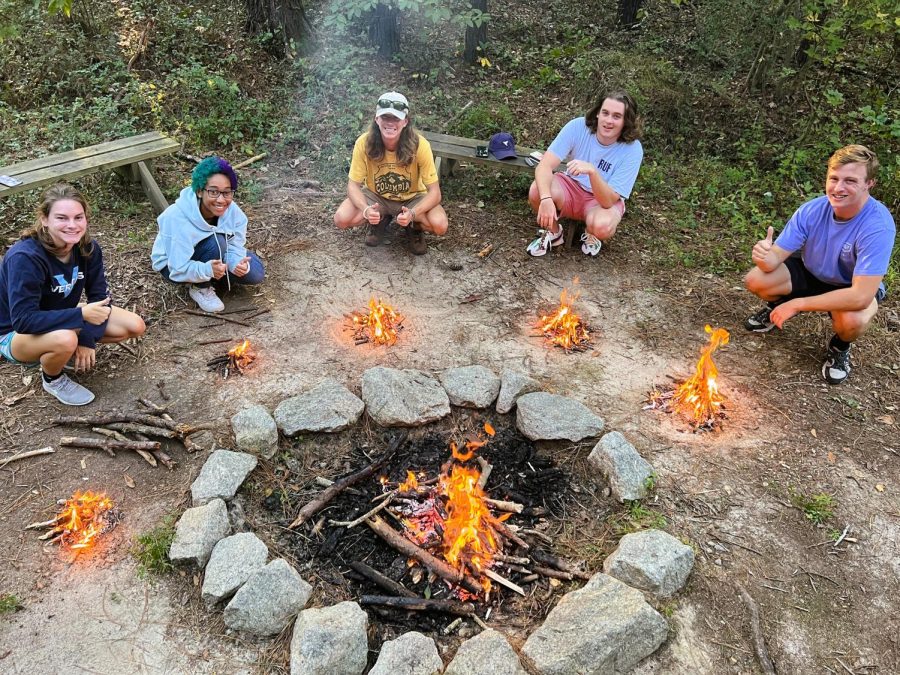 Students show off their fires that they built from scratch!