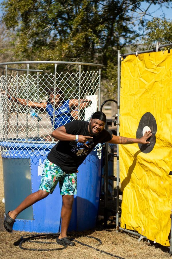 DeMoni Reeves dunks Ibrahim Fadesire while with their fraternity, Phi Beta Sigma, at the rotunda on February 13. The group set up the tank to fund-raise for their Tru Bear Gentleman Club, which serves as a local youth mentorship program.
