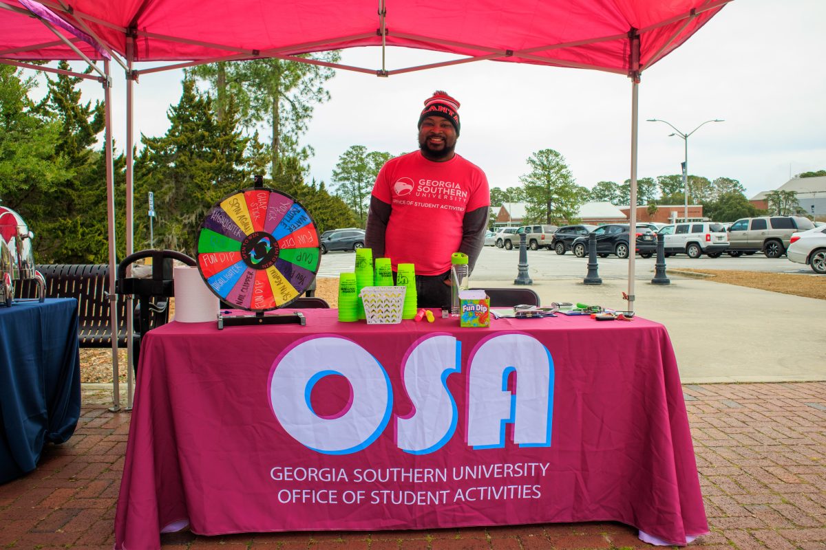 Coleman Bailey (OSA Staff) welcomed students to the event with prizes to win and hot drinks. 