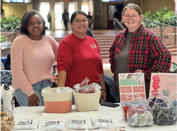 Mambwe Mutiti, Ingrid Mateo-Anderson, and Elizabeth Guidry helped pass out free safe sex supplies and offered free HIV tests in the Russell Union. 