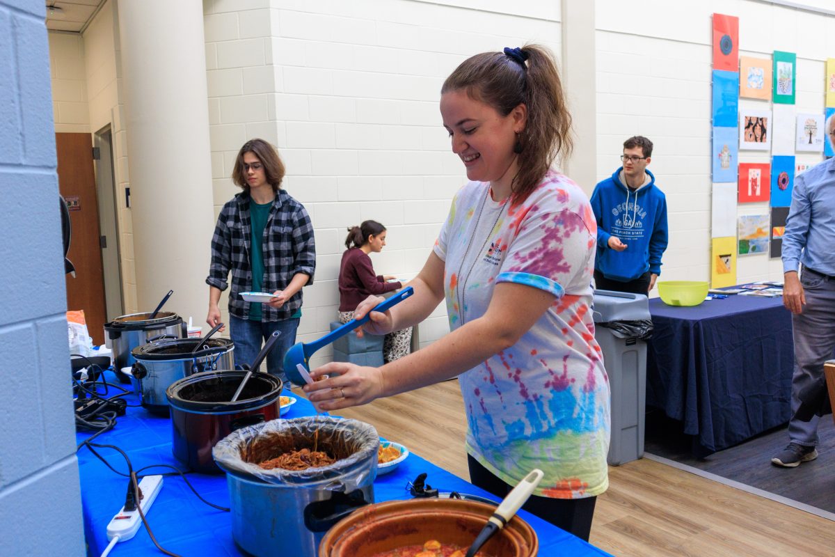 Anna Currence Oneal (staff member of the College of Behavioral and Social Sciences.) getting herself a bowl of chili.