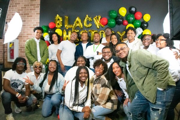 Georgia Southern’s Gospel Choir poses in front of the yellow, red, green and black decorated balloon wall honoring and celebrating Black History Month at the Kick-Off Event on February 6. 