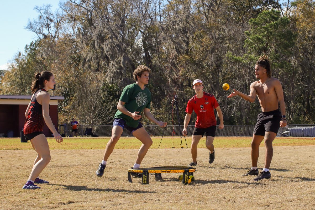Daniel Barber (right) bounced the ball to Chase Brimhal (Green shirt) during their match against UGA.