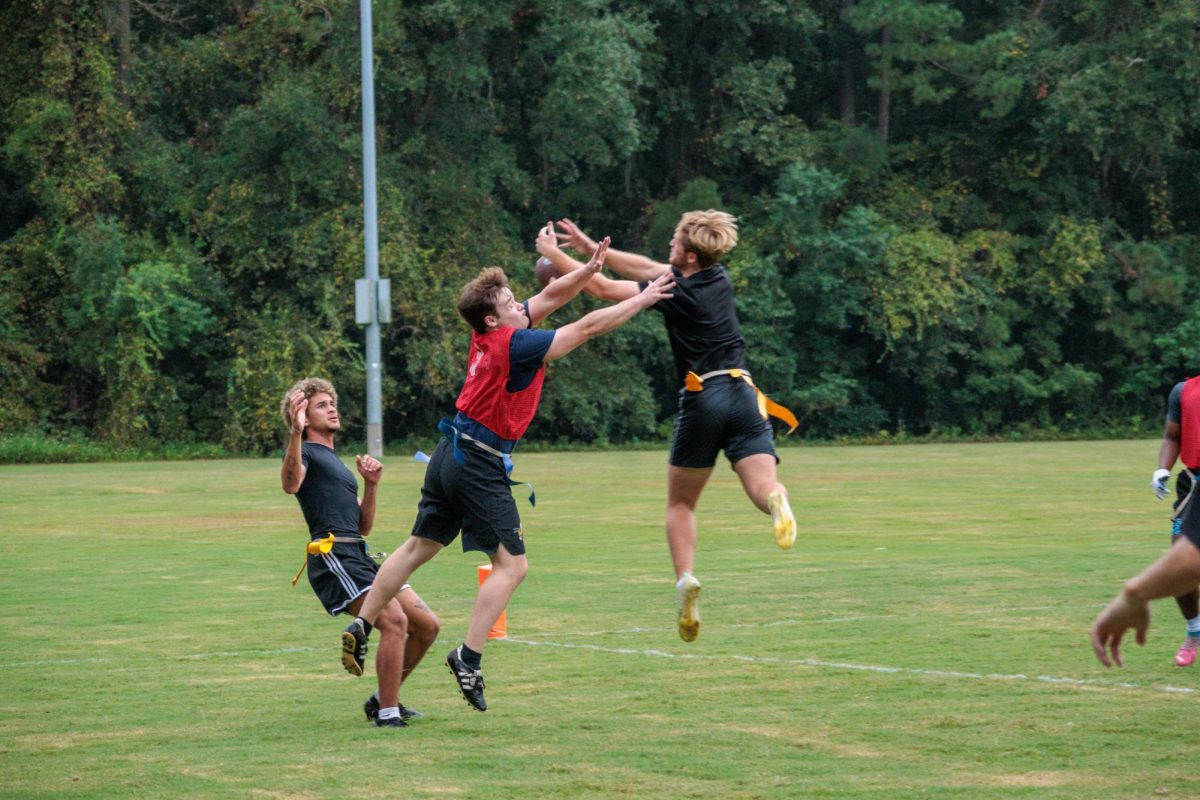 Jackson McCook (Team: The Seven) blocking Lane Hammond (Team: Eagles) from catching the ball