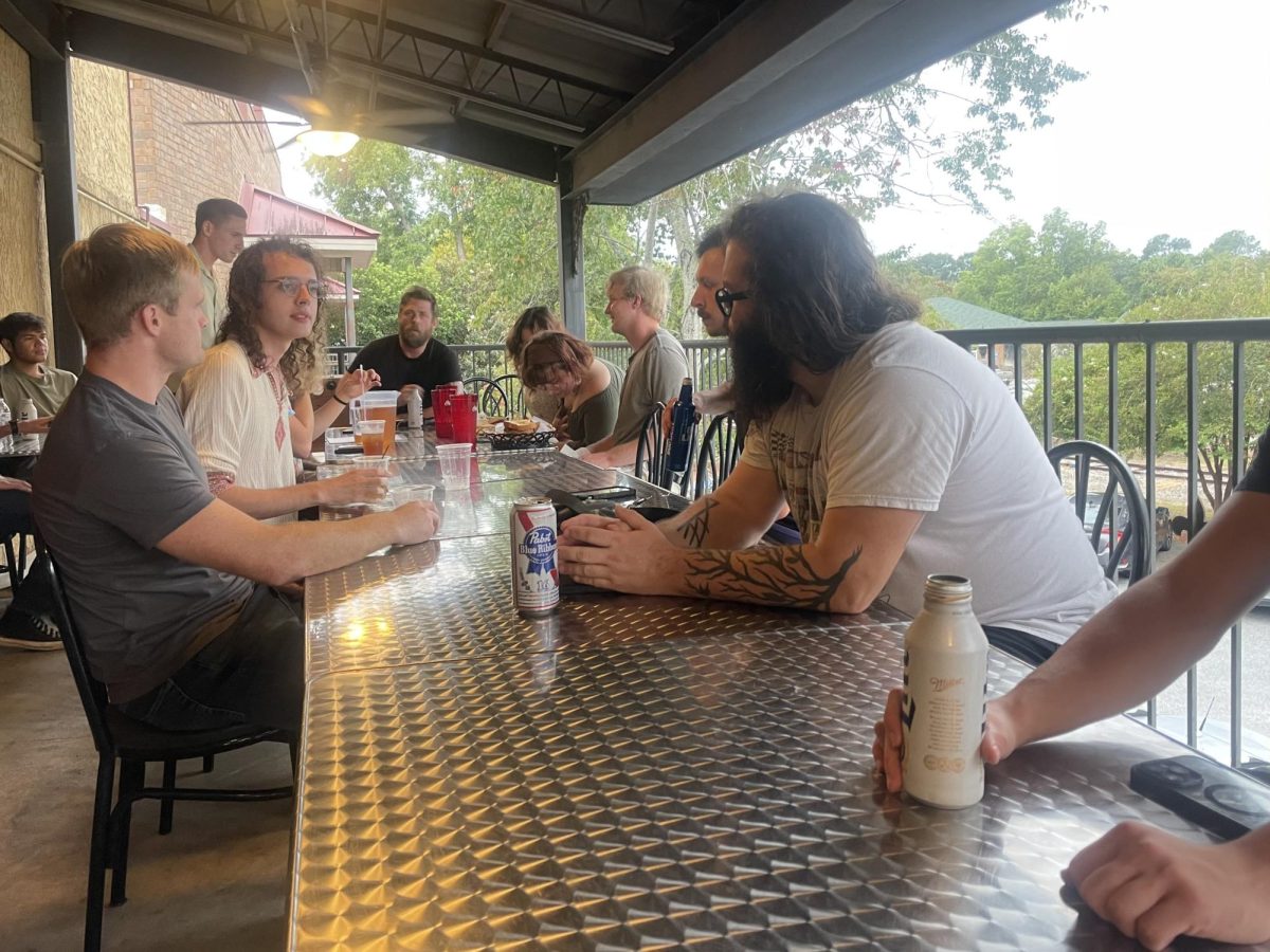 Students attend the Sept. 5 meeting at Eagle Creek Brewery to discuss justice. 