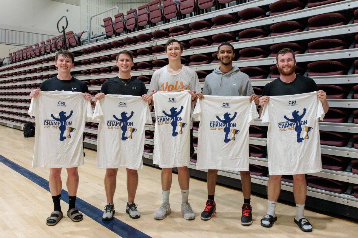 Winners of championship game, Average Joes, posing with their t-shirts