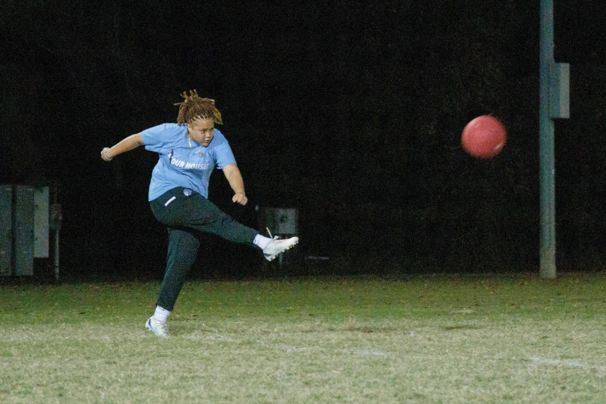 Alexis Deveaux (team: The Mavericks) kicking the ball