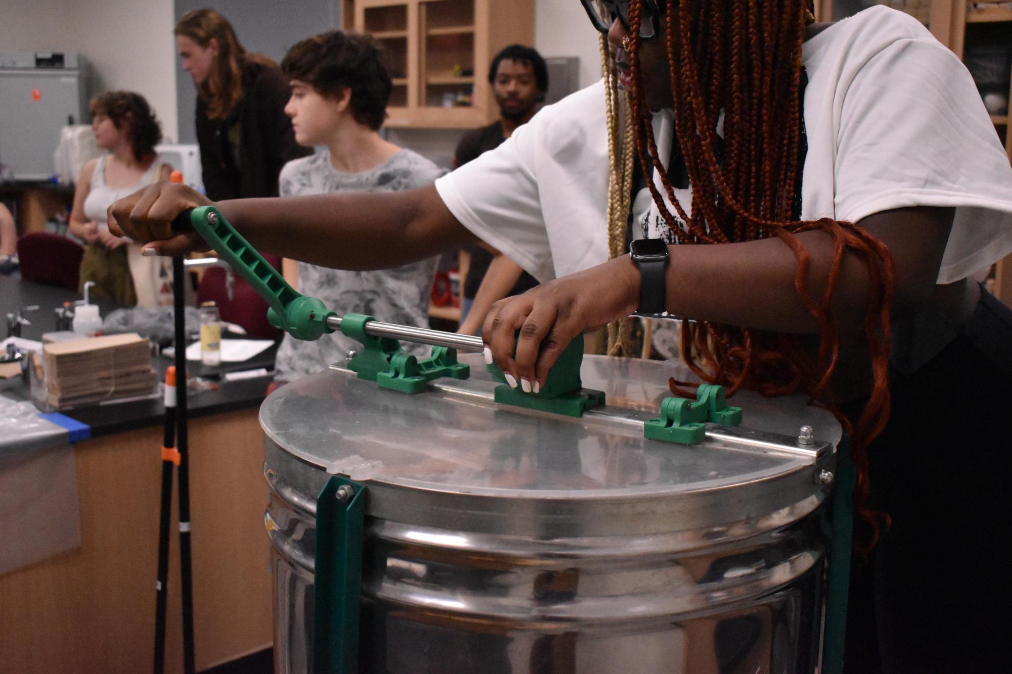 Armstrong Eco Advocates Harvest Honey from Campus Hives