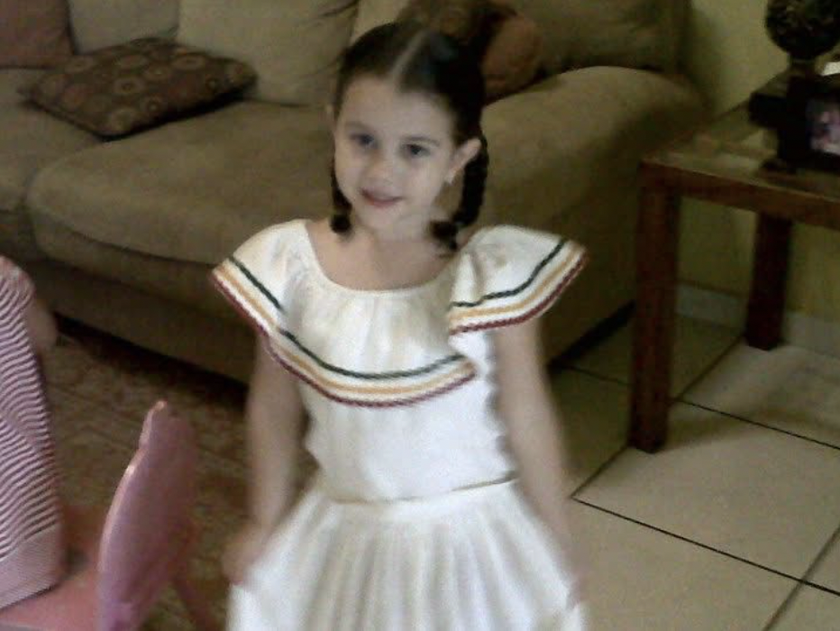 The writer of this article, in a Honduran dress, Dominique Vidal, embracing her culture.