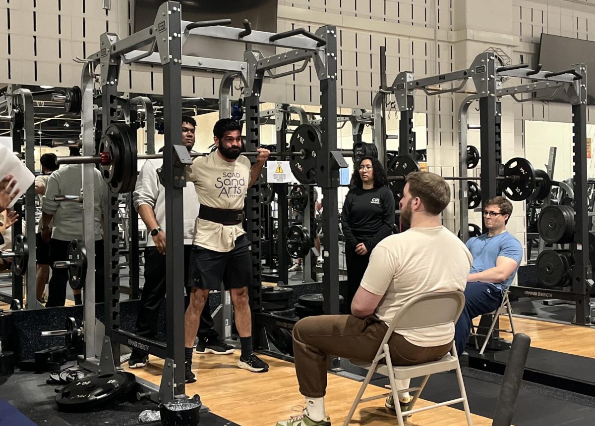 Naren Bhimbra finishing the second round of the barbell squat event.